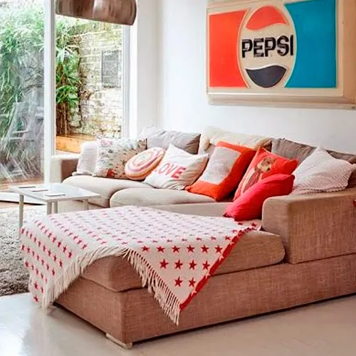 sofa de canto com manta para decorar
